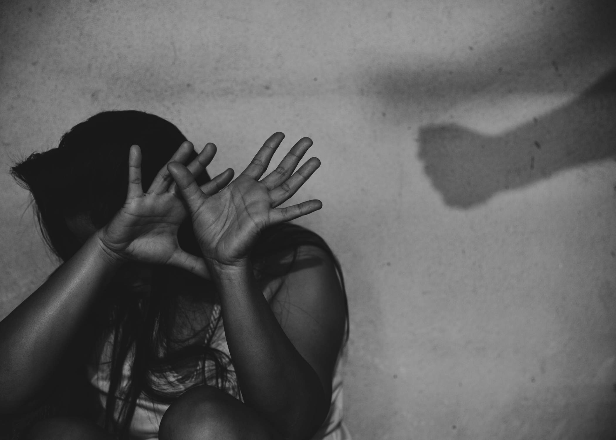 Women sitting with fist shadow